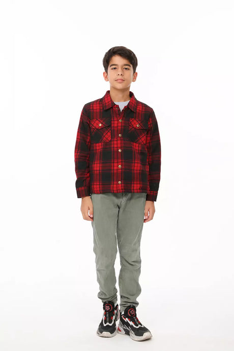 A boy in red flannel plaid shacket