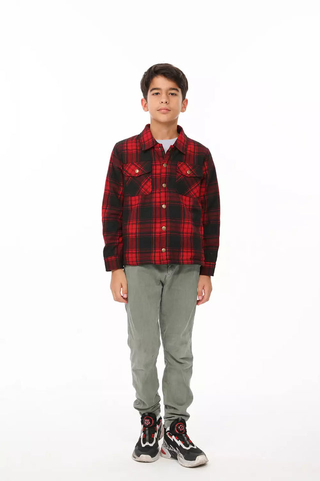 A boy in red flannel plaid shacket