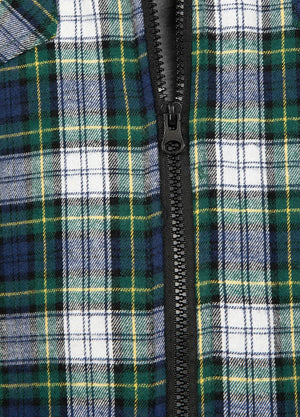 Close-up of the zipper of the green and white men's fashionable flannel jacket 