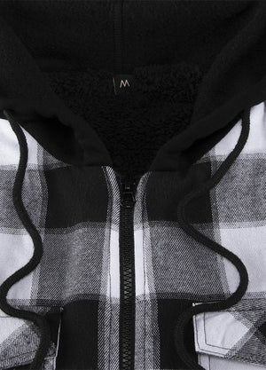 Close-up of the zipper of a black and gray men's winter flannel shacket with a hood
