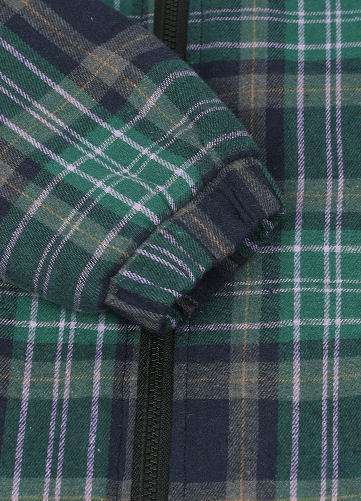 Close-up of elastic cuffs on kid's green thermal flannel jacket