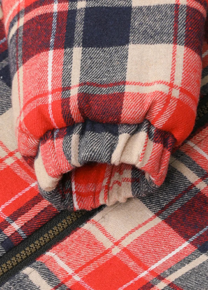Close-up of elastic cuffs on kid's red thermal flannel jacket
