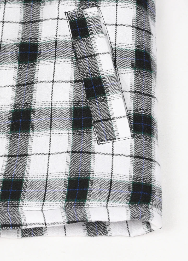 Close-up of two side pockets on kid's white thermal flannel jacket