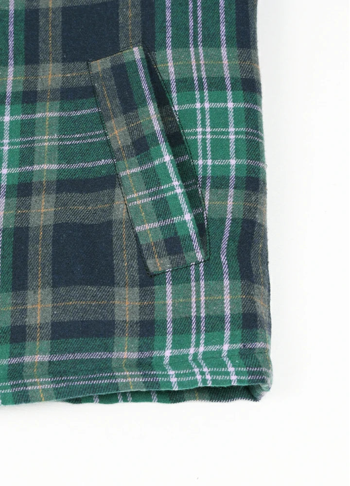 Close-up of two side pockets on kid's green thermal flannel jacket