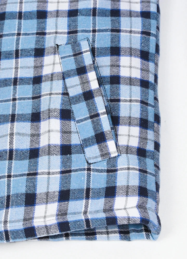 Close-up of two side pockets on kid's blue thermal flannel jacket