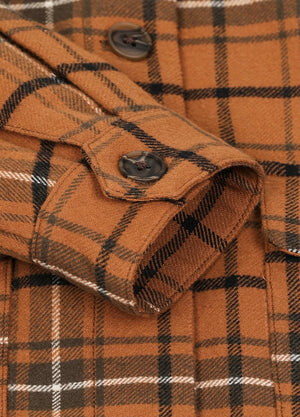 Close-up of women's fall winter orange flannel shacket cuffs