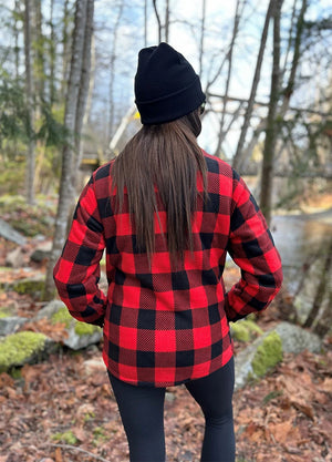 Back view of women in a red black winter sherpa-lined shirt jacket