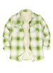 Front view of a womens sherpa-lined green plaid fleece shirt jacket
