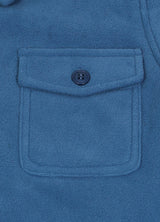 Detail of kids light blue flannel jacket pocket with button