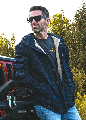 Lifestyle view of a man wearing indigo men's sherpa lined water repellent flannel jacket with hood 100% cotton-XR1142IO-S,XR1142IO-M,XR1142IO-L,XR1142IO-XL,XR1142IO-XXL