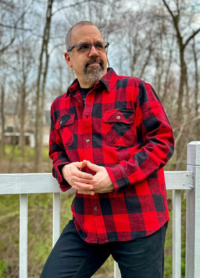 Lifestyle view of a man wearing red buffalo plaid men's stalwart heavyweight flannel shirts-XR119RED0S,XR119RED0M,XR119RED0L,XR119RED0XL,XR119RED0XXL