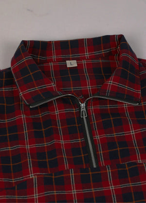 Close-up of the neckline of red and navy women's quarter zip flannel shirt 