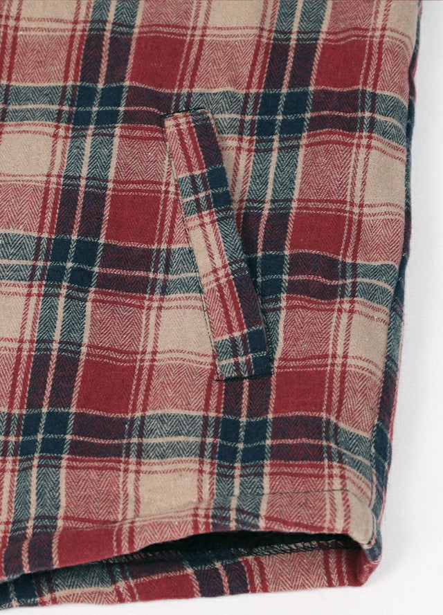 Close-up of the hand pocket of red and khaki men's plaid fleece lined flannel shirt jacket 