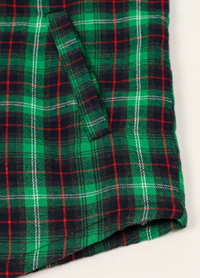 Detailed view of the hand pocket of a green men's snap button hooded jacket 