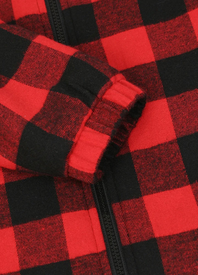 Close-up view of the elastic cuff detail on the kid's full zip-up lambswool-lined jacket in red