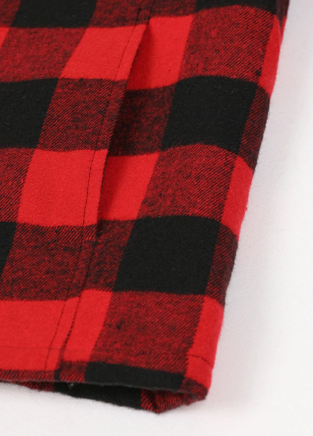 Close-up view of the hand pocket detail on the kid's full zip-up lambswool-lined jacket in red