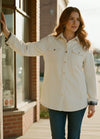 Lifestyle view of a woman wearing cream women's oversized fit flannel-lined long-sleeve corduroy shirt jacket-XR191BJL-S,XR191BJL-M,XR191BJL-L,XR191BJL-XL