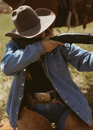Lifestyle view of a woman wearing light indigo women's flannel-lined denim shirt jacket snap jean shacket-XR192QL0S,XR192QL0M,XR192QL0L,XR192QL0XL