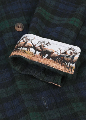 Detailed view of the printed cuffs on a mens dark green flannel shirt