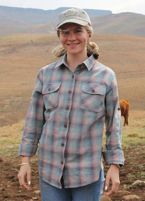 Lifestyle view of a woman wearing blue pink women's wildlife adventure flannel plaid shirt-XR198BP-S,XR198BP-M,XR198BP-L,XR198BP-XL,XR198BP-XXL