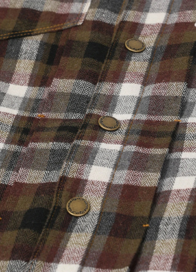 Detailed view of the button of a coffee white men's winter fleece lined button up shirt jacket
