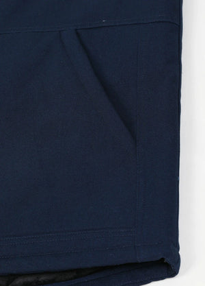 Close-up of the arctic-lined hand warmer pocket on men's quilted canvas work vest