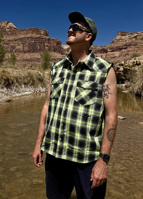 Front view of a man in a green cool snap pearl western plaid vest for men standing in the water-XR618NG-S,XR618NG-M,XR618NG-L,XR618NG-XL,XR618NG-XXL
