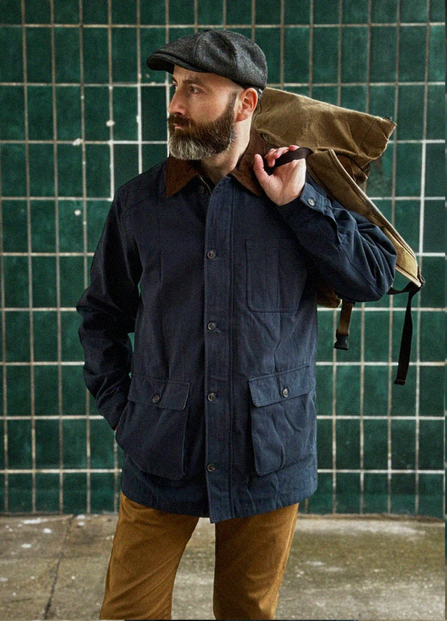 Lifestyle view of a man wearing navy men's heritage vintage field jacket-XR807NY-M,XR807NY-L,XR807NY-XL,XR807NY-XXL