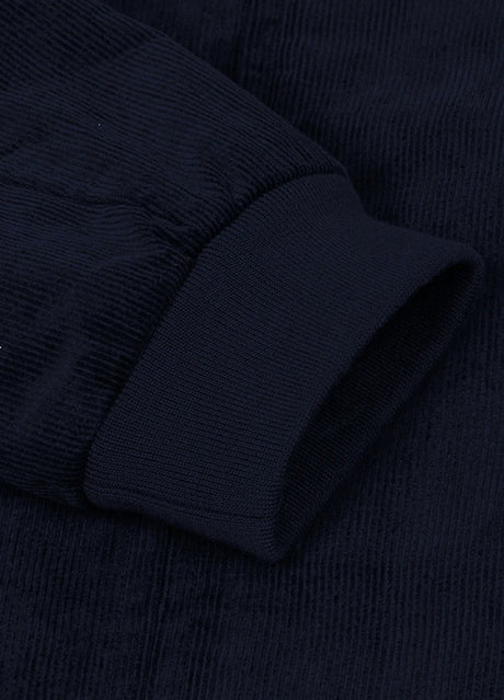 Close-up of the cuff of navy men's winter vintage corduroy solid jacket