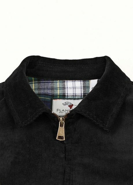Close-up of the lapel of black men's soft vintage corduroy jacket