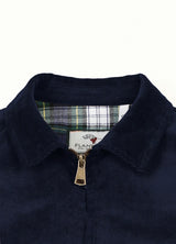 Close-up of the lapel of navy men's soft vintage corduroy jacket