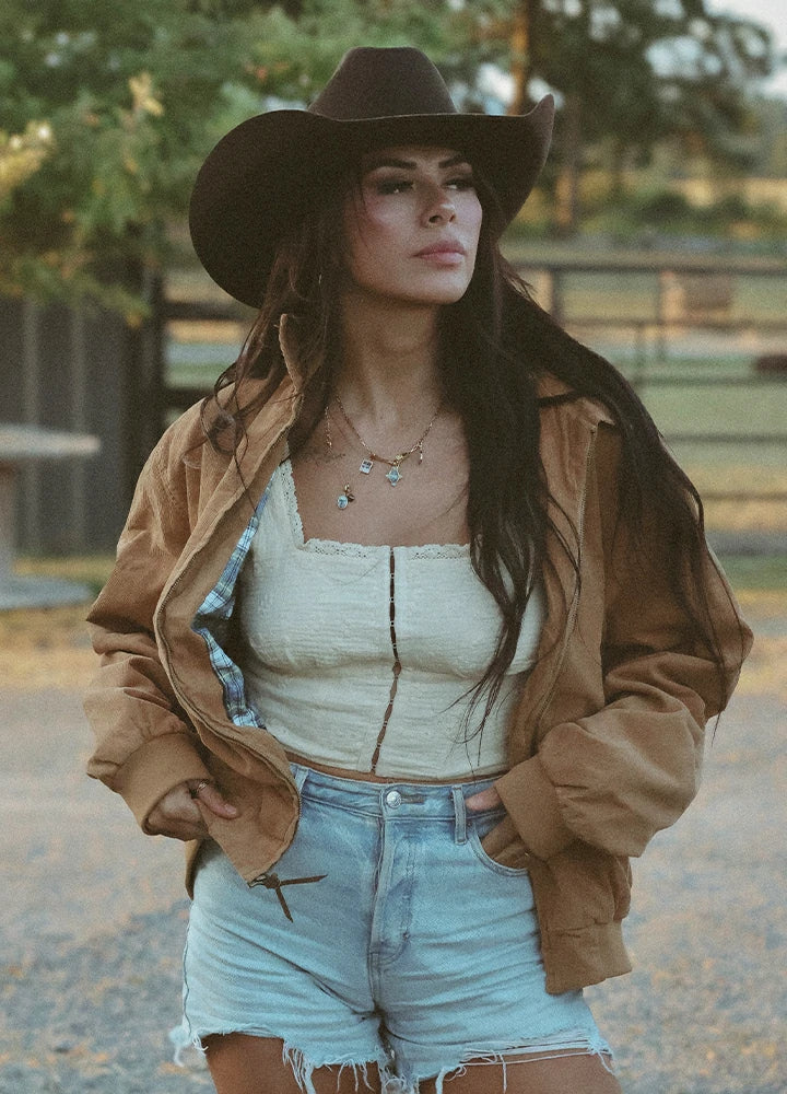 Women in a khaki full zip corduroy jacket with flannel lining