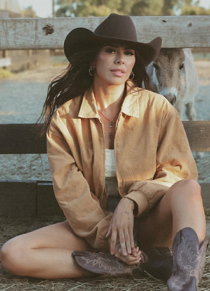 Lifestyle view of a woman wearing khaki women's vintage corduroy jacket-XR811KI-S,XR811KI-M,XR811KI-L,XR811KI-XL