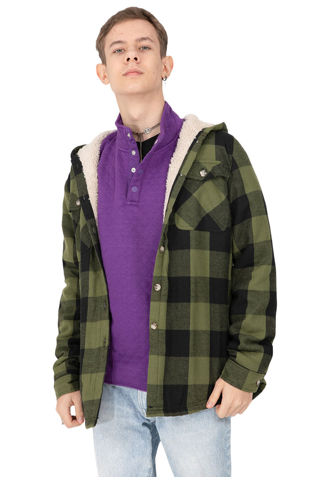 A boy wearing a purple fleece pullover shirt as underlayer
